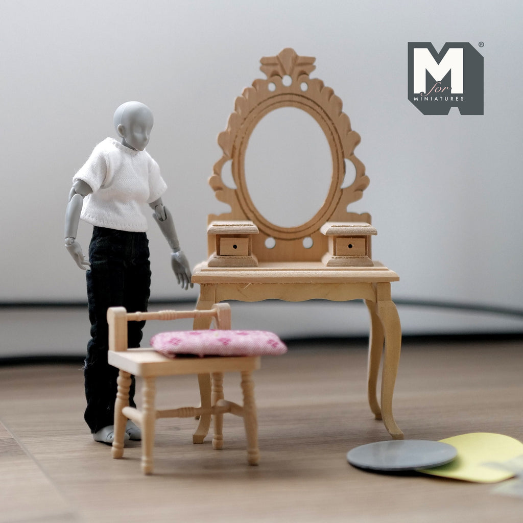 1:12 scale miniature unpainted wood dressing table with oval mirror and chair, carved frame, shown with a figure for scale