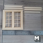 1:12 scale miniature unfinished wood window with acrylic pane and back trim, ready to paint, parts laid out with a ruler