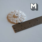 1:12 scale miniature Victorian ceiling rose with center hole in white cast resin, ornate floral relief, with a ruler