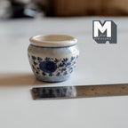1:12 scale miniature large ceramic planter pot in white with blue floral pattern, round belly shape, shown with a ruler