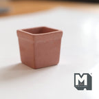 1:12 scale miniature large terracotta tree pot, square and tapered with a thick rim, shown on a white surface