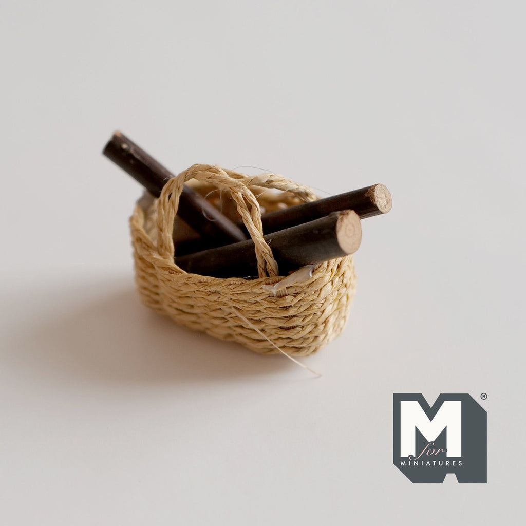 1:12 scale miniature rope log basket with fire logs, natural woven basket with handle, shown on a white surface