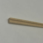 1:12 scale miniature lightwood wall and ceiling molding, skirting board and picture rail, close-up of the profile end