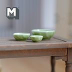 1:12 scale miniature green ceramic bowls, set of 3 in graduated sizes, shown on a dark wood table