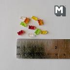 1:12 scale miniature assorted gummy bear candies, set of 10 in red, green, yellow, orange and clear, shown with a ruler