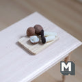 1:12 scale miniature wood serving board with brown and white mushrooms, set of 6, shown on a white table