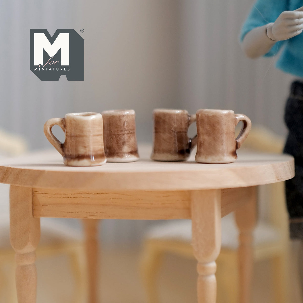 1:12 scale miniature ceramic beer mugs in mottled brown and cream glaze, set of 4, shown on a round wood table