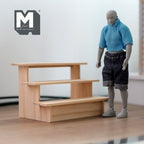 1:12 scale miniature unpainted wood 3 tier display shelf, short stepped fruit stand, shown beside a jointed figure