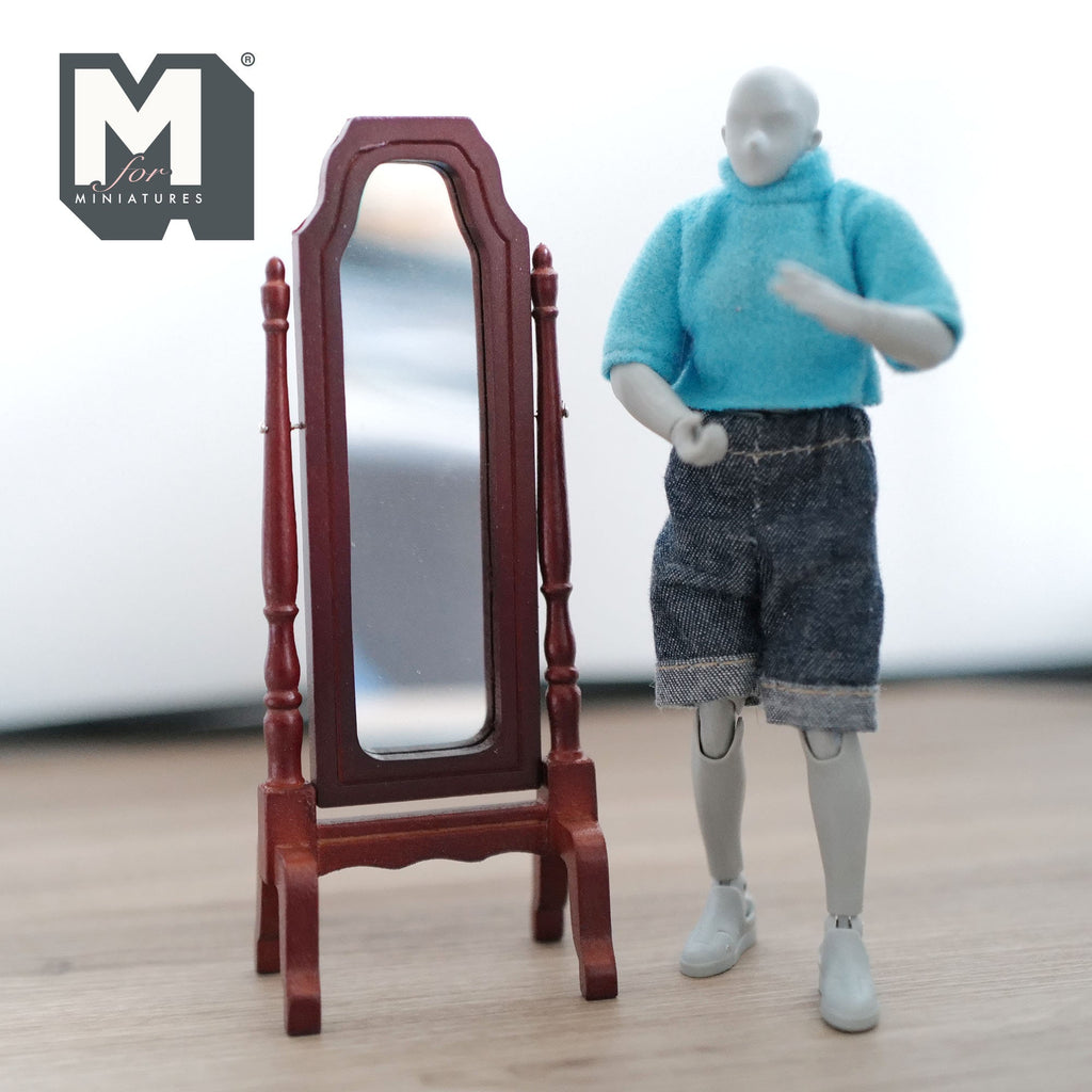 1:12 scale miniature wood full length cheval mirror in mahogany, free standing, shown beside a poseable figure for scale