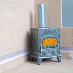 1:12 scale miniature cast resin retro wood burning stove with chimney, gray blue with an orange fire window