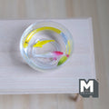 1:12 scale miniature glass fish bowl with 2 fish, one red and white and one yellow, in clear water on a white wood table
