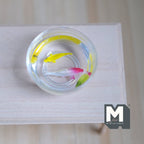 1:12 scale miniature glass fish bowl with 2 fish, one red and white and one yellow, in clear water on a white wood table