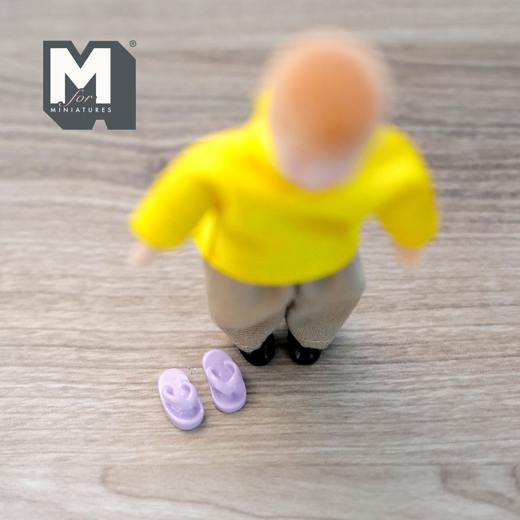 1:12 scale miniature children's shoes in purple, 1 pair of sandals, shown on a wood floor beside a child figure