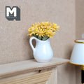 1:12 scale miniature yellow flowers in a white ceramic pitcher vase, daisy style blooms, shown on a wood mantel shelf