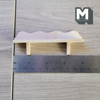 1:12 scale miniature wood wall bracket shelf with scalloped edge in bare wood, two brackets, shown with a ruler