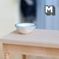 1:12 scale miniature ceramic bowl in white with light blue rim, shown on a light wood table