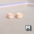 1:12 scale miniature terracotta flower pots in beige, set of 2 low round pots, shown on a beige surface