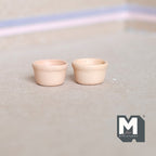 1:12 scale miniature terracotta flower pots in beige, set of 2 low round pots, shown on a beige surface