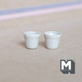 1:12 scale miniature white ceramic flower pots with tapered sides, set of 2, shown side by side on a beige surface
