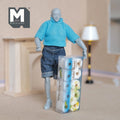 1:12 scale miniature patterned toilet paper rolls in a clear box, 10 rolls in blue and yellow, shown with a poseable figure