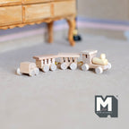 1:12 scale miniature unpainted wood train, 4 pieces, engine with three cars in natural wood, shown on a beige carpet