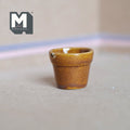 1:12 scale miniature glazed ceramic tree pot in amber brown, large size, tapered shape, shown on a gray floor