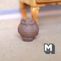 1:12 scale miniature brown clay owl shaped flower pot with feather texture, shown on a floor near a wood table