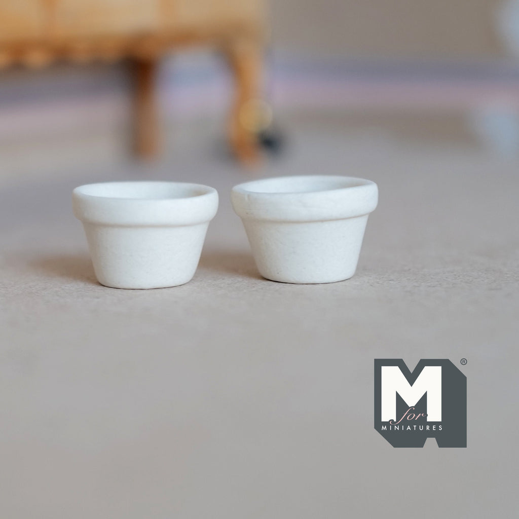 1:12 scale miniature terracotta clay flower pots in cream white, set of 2, shown empty side by side on a floor
