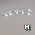 1:12 scale miniature wall hooks in white, set of 6, single curved hooks with round bases, shown on a tan surface