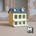 1:12 scale miniature wood little house in light yellow with hinged front and roof, 2 rooms, gray roof with dormers