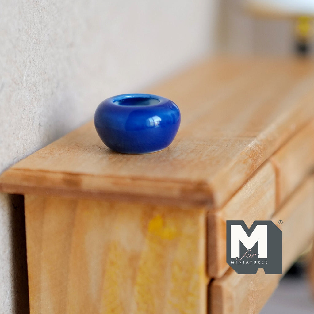 1:12 scale miniature cobalt blue glazed ceramic planter bowl, round squat shape, shown on a wood dresser
