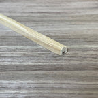 1:12 scale miniature unpainted wood rounded top handrail with groove, close up of the end profile