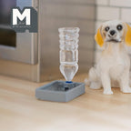 1:12 scale miniature pet water dispenser in gray with clear bottle, shown on a kitchen floor beside a toy dog