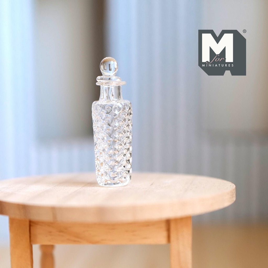 1:12 scale miniature glass pasta jar with stopper and spaghetti, diamond cut pattern, on a round wood table