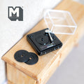 1:12 scale miniature metal turntable in black with clear dust cover and 2 vinyl records, non working, on a dresser