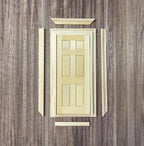 1:12 scale miniature unpainted wood 6 panel door with double frame and back trim pieces, laid out flat