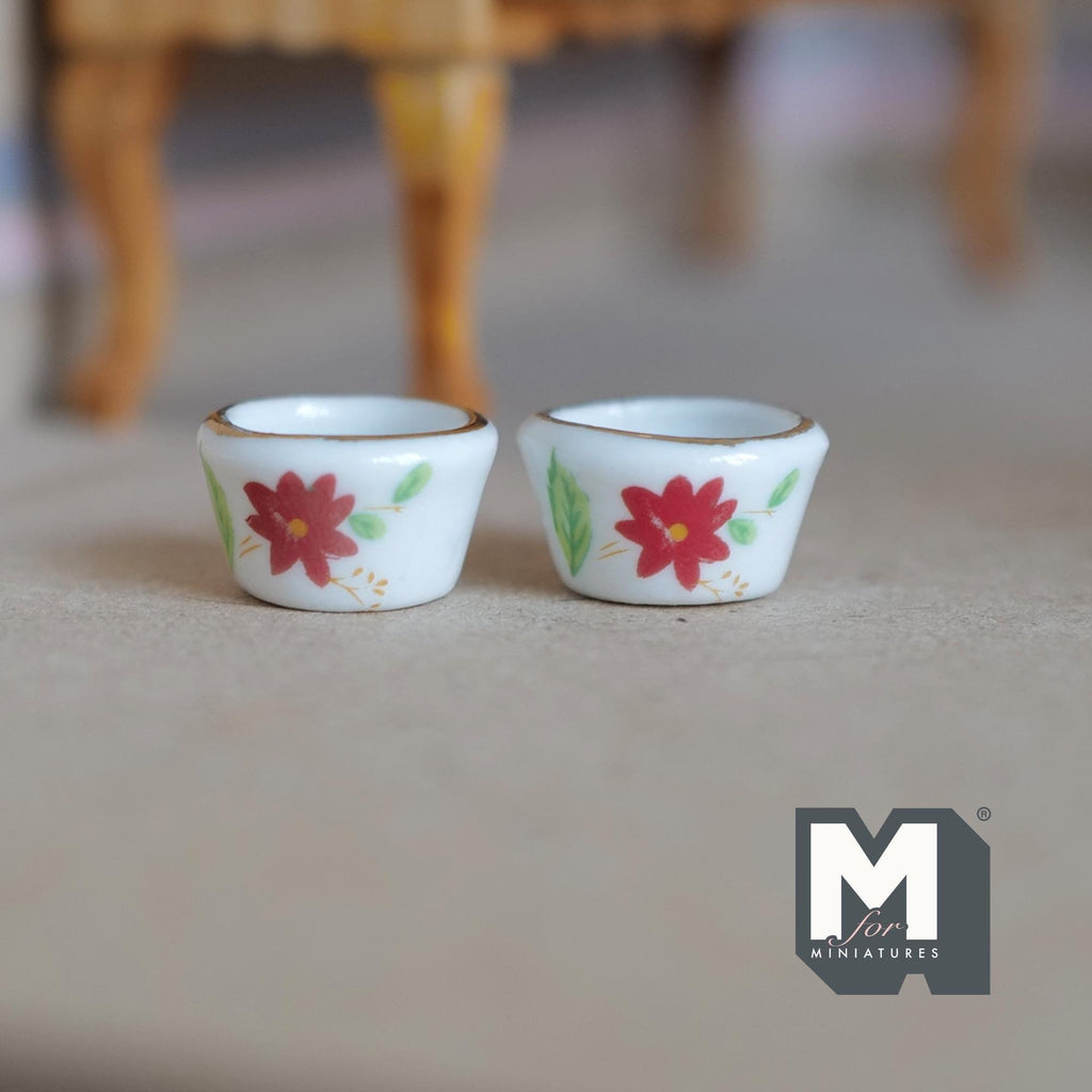 1:12 scale miniature white ceramic flower pots with red floral print, set of 2, shown on a wood floor