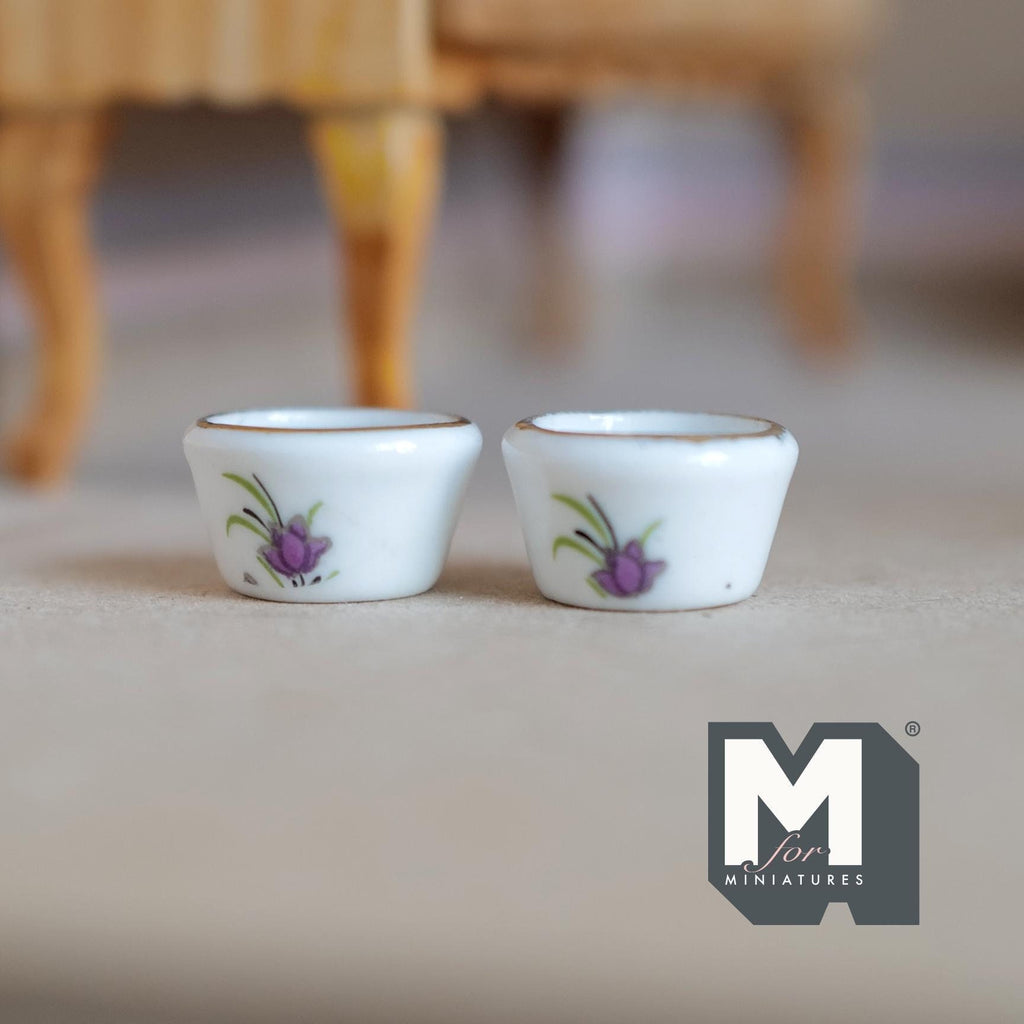 1:12 scale miniature ceramic flower pots in white with a purple floral print, set of 2, shown on a gray floor