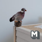 1:12 scale miniature cast resin pigeon perched on a post, gray with a white neck patch, shown on a ledge