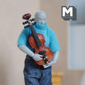 1:12 scale miniature wood violin with bow, glossy reddish brown finish with black fittings, held by a poseable figure