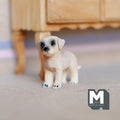 1:12 scale miniature cast resin standing Labrador puppy in cream, shown on the floor near a wood table