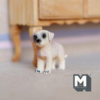1:12 scale miniature cast resin standing Labrador puppy in cream, shown on the floor near a wood table
