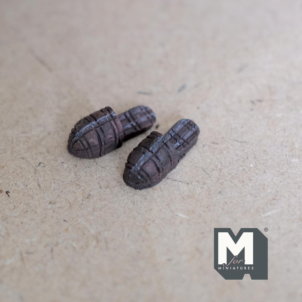 1:12 scale miniature woven strap sandals in dark brown, one pair, shown on a gray felt surface