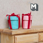 1:12 scale miniature hat boxes with red bows, set of 2 in aqua and pink check, hats not included, on a wood dresser