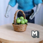 1:12 scale miniature wicker basket of green apples with arched handle, shown on a round wood table