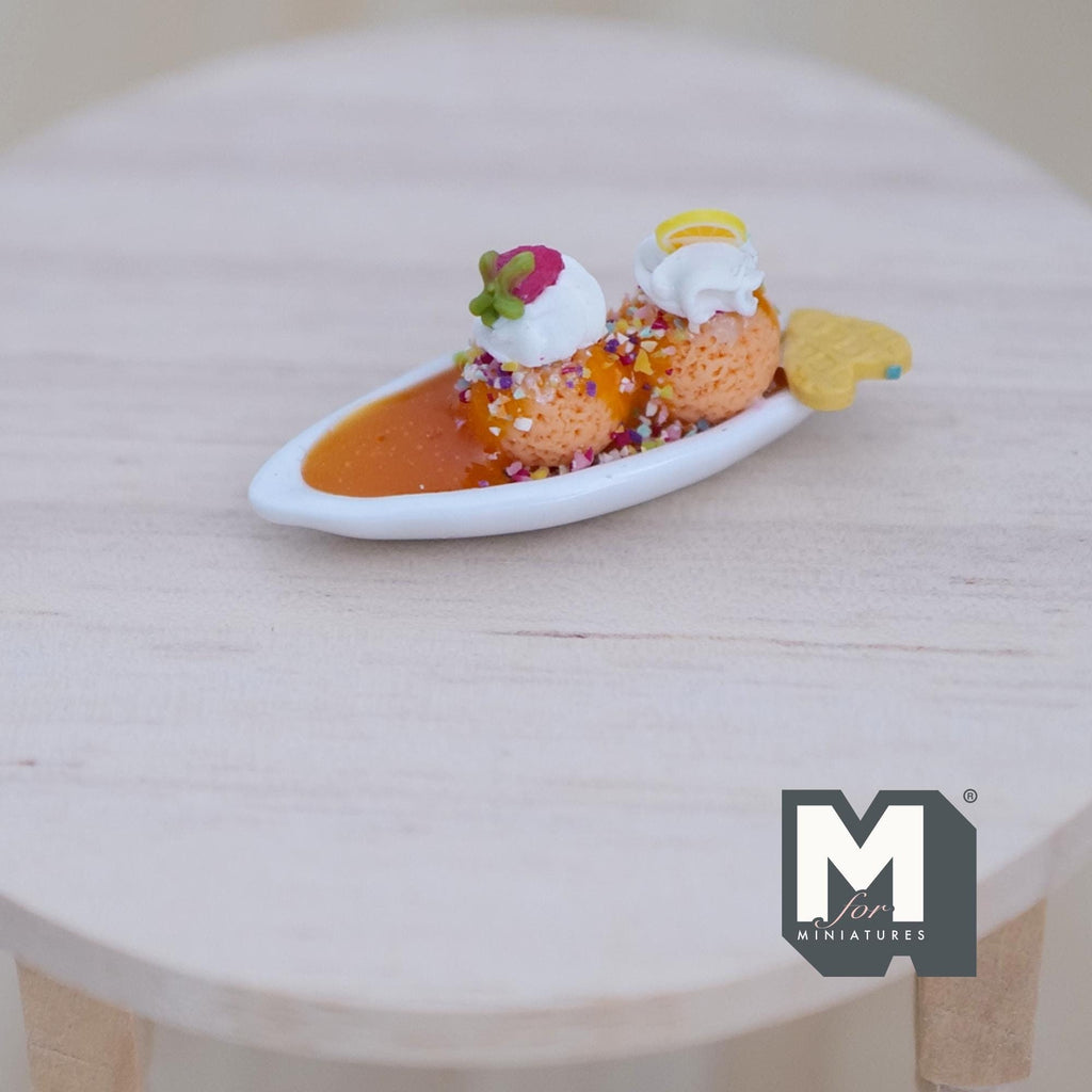 1:12 scale miniature green tea ice cream sundae on a white oval plate with banana, cream and caramel sauce
