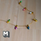 1:12 scale miniature light bulb beads chain with gold string, non working, cut to length, multicolor bulbs on wood