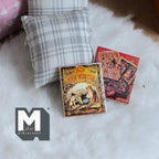 1:12 scale miniature children's story books with illustrated covers, set of 2, shown on a white fur rug by a pillow