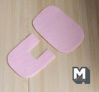 1:12 scale miniature bath mat and U shaped toilet mat in pink, set of 2, soft felt look shown on a wood floor
