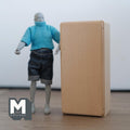 1:12 scale miniature unpainted wood column refrigerator with 4 shelves, shown closed beside an artist figure for scale